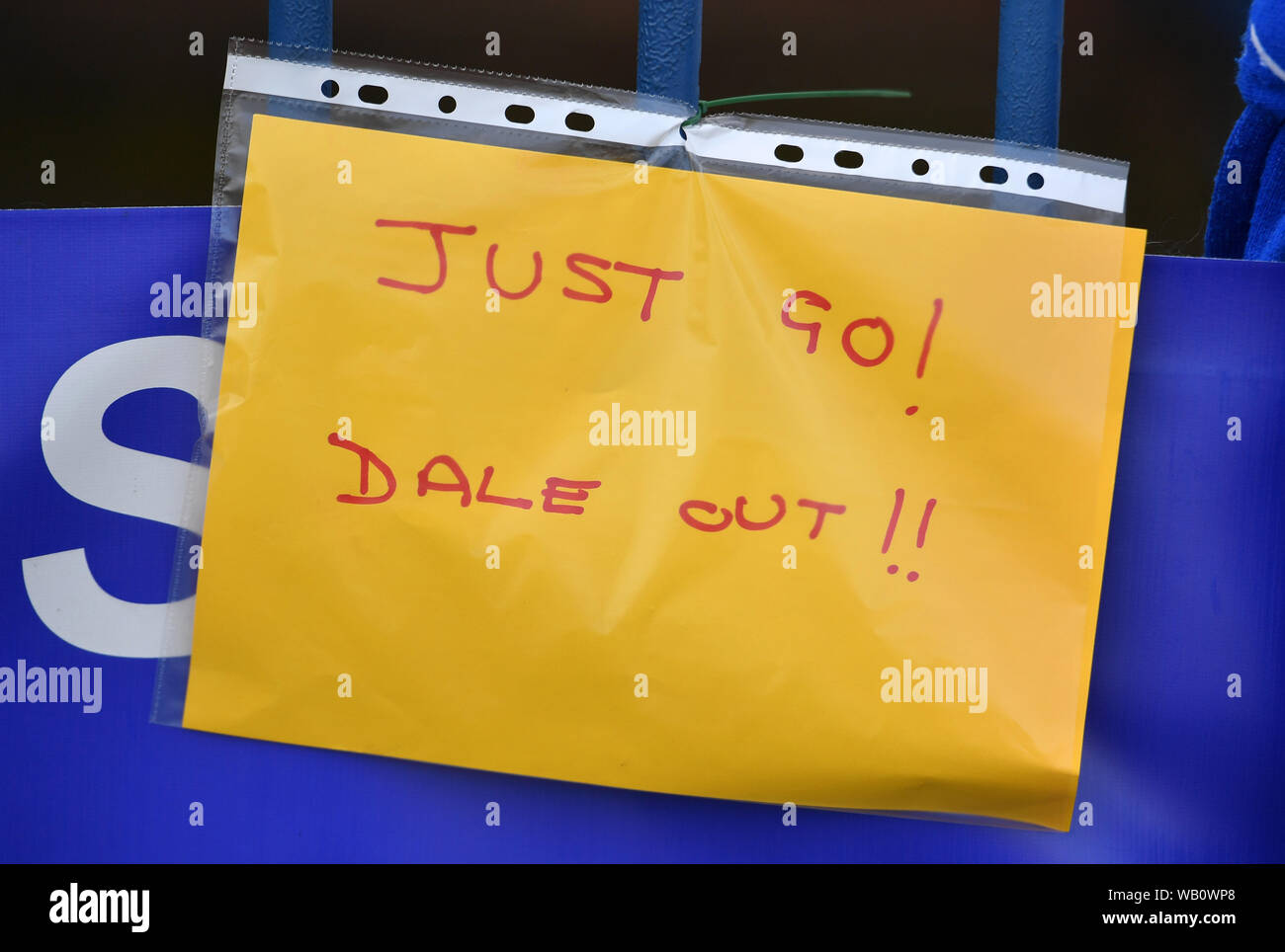 A view of notes written by fans pinned to the gates at Gigg Lane, home