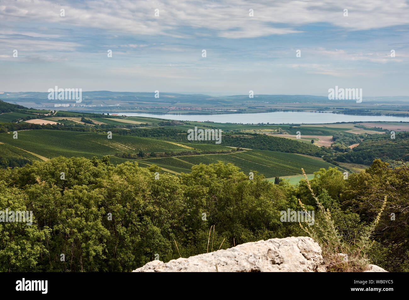Landscape view of Palava in South Moravia. Lake Nove Mlyny and towns Pavlov and Klentnice under blue sky with clouds Stock Photo