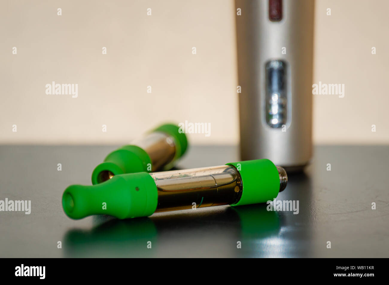 Vape kit with cartridges. Marijuana THC CBD oil vape juice. Stock Photo