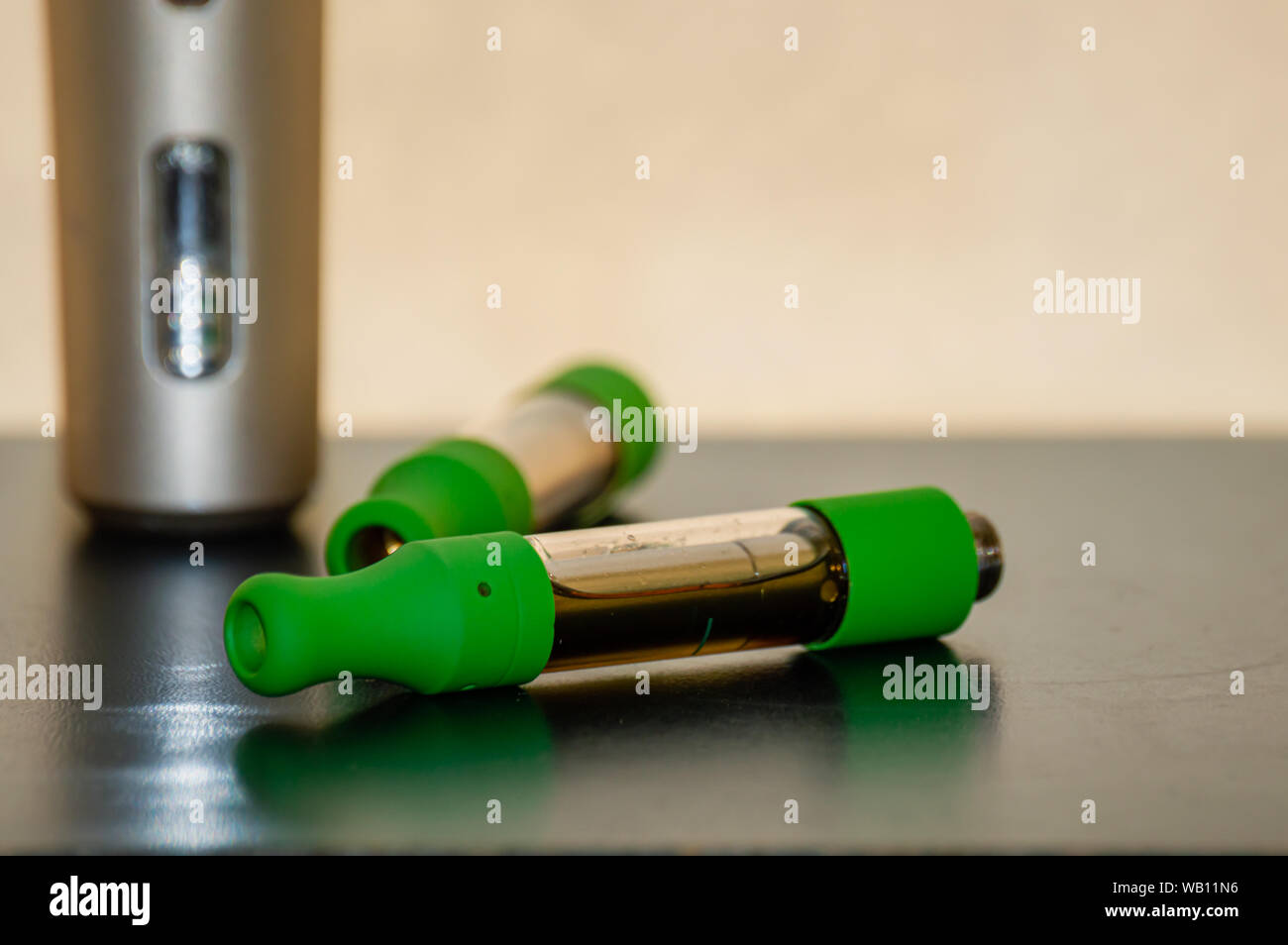 Vape kit with cartridges. Marijuana THC CBD oil vape juice. Stock Photo