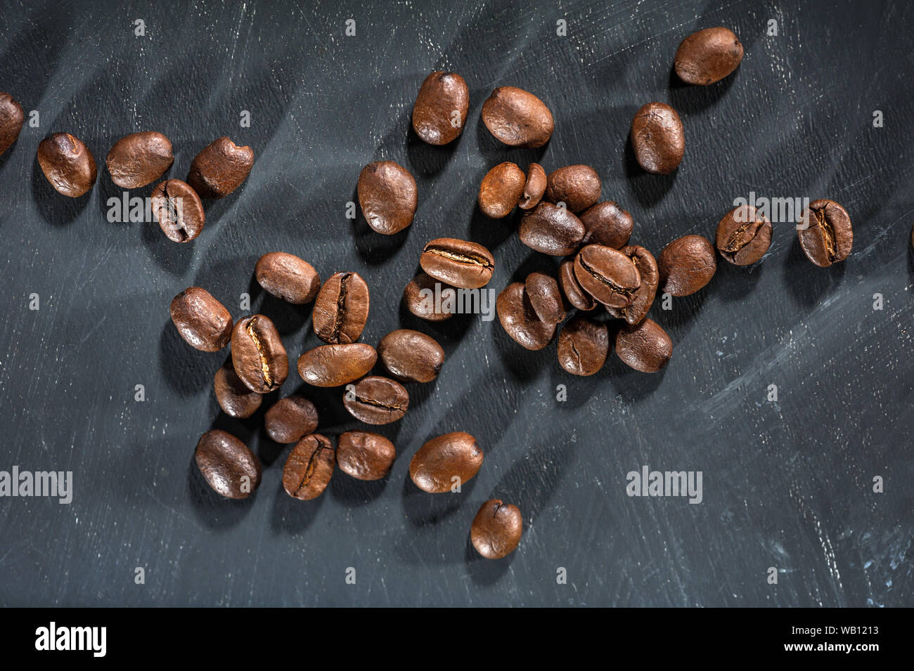 Roasted Coffee beans on a black background Stock Photo - Alamy
