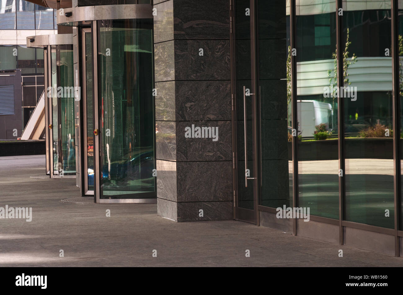 Curved doorway to the office, bank, corporation. Glass and metal doors Stock Photo
