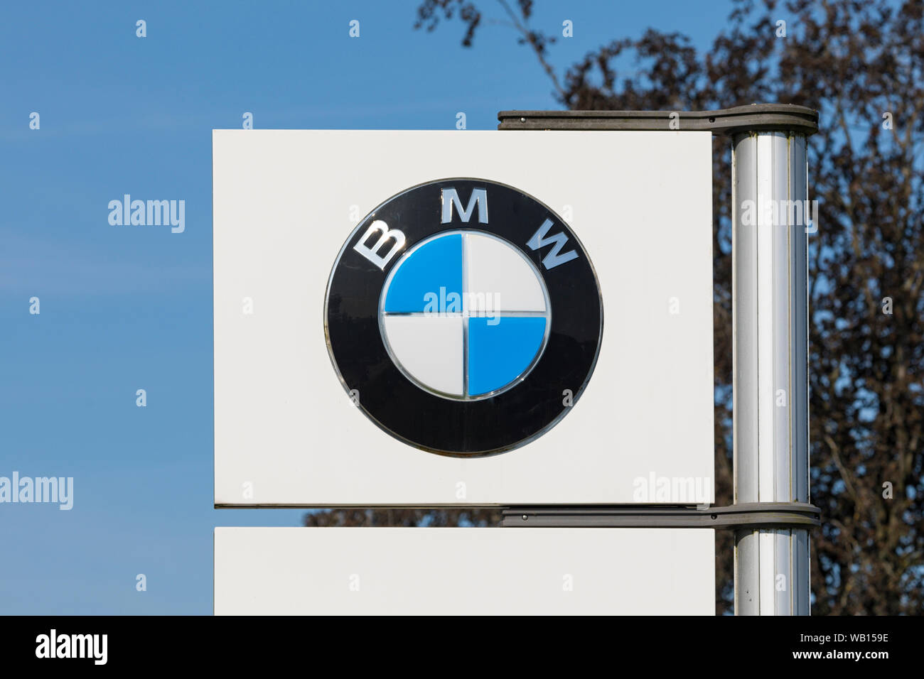 Stade, Germany - August 22, 2019: Logo on pole identifying a BMW dealership. Stock Photo