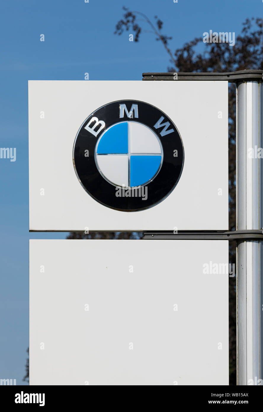 Stade, Germany - August 22, 2019: Logo on pole identifying a BMW dealership. Stock Photo