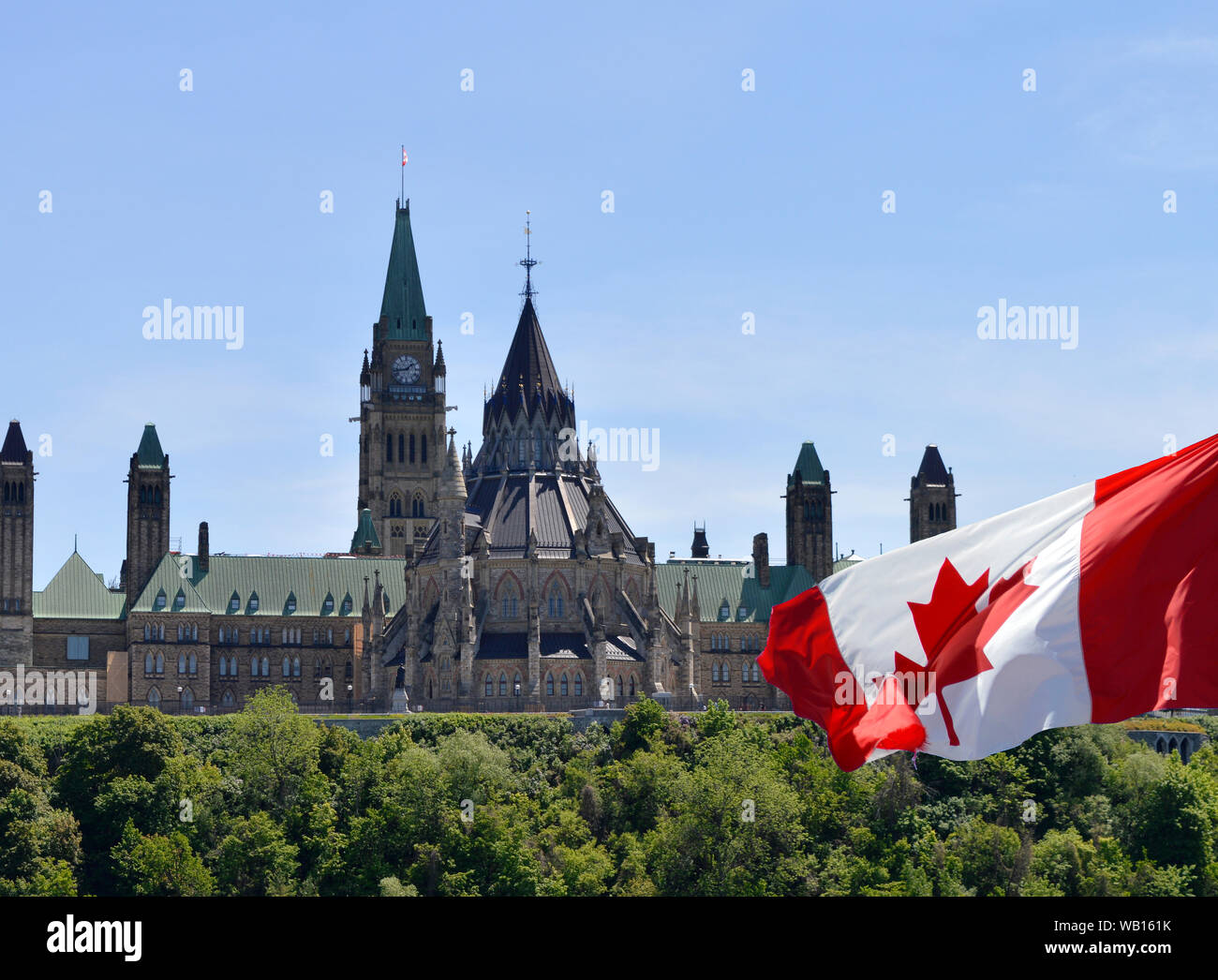 Canadian parliament buildings with Canada flag in foreground Stock Photo
