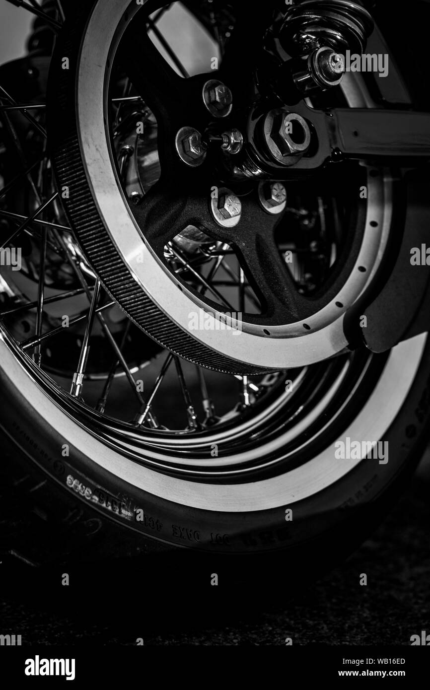 Motorcycle chrome wheel, tire and mechanical drive parts Stock Photo