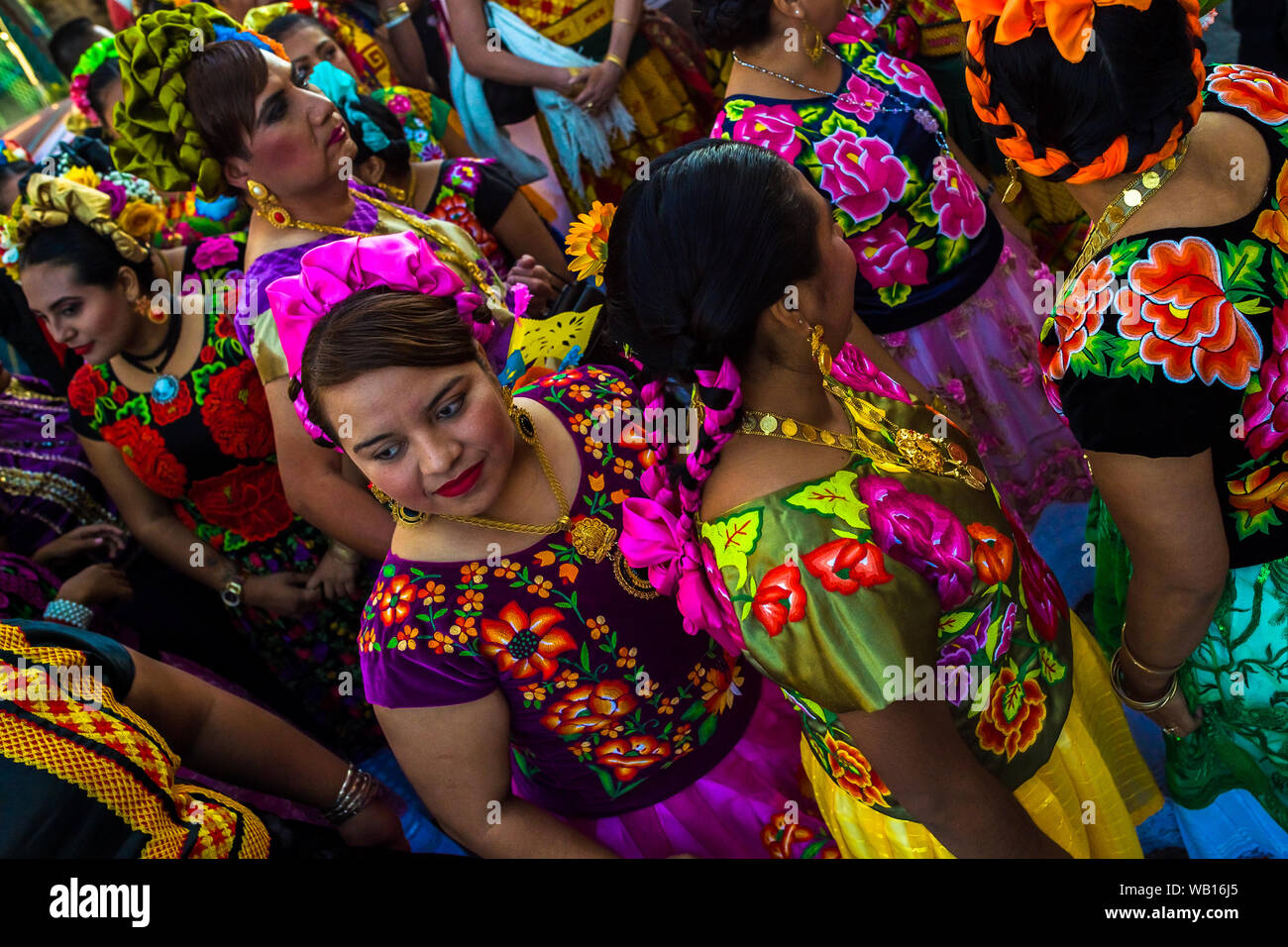 Mexican women of Zapotec origin, wearing traditional Tehuana dress, take part in the festival in Juchitán de Zaragoza, Mexico. Stock Photo