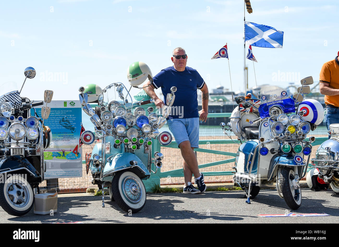 Brighton, UK. 23rd August 2019.  Mods on their scooters from all over the country start to arrive in Brighton for the bank holiday weekend on a beautiful hot sunny day . It is the 50th anniversary of the famous Mod film Quadrophenia starring Leslie Ash and Phil Daniels which was partly filmed in Brighton and Sussex with various events taking part in the city over this coming weekend to mark the event . Credit : Simon Dack / Alamy Live News Stock Photo