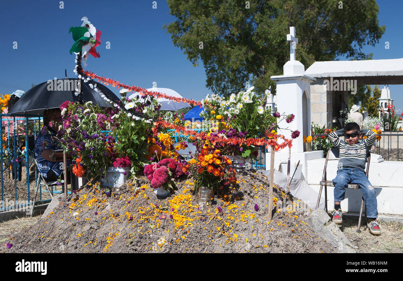 Mexico's 'Dia De Los Muertes' - the day of the year when Mexican's 'celebrate' the dead by bringing flowers and food to the graves of loved ones. Stock Photo