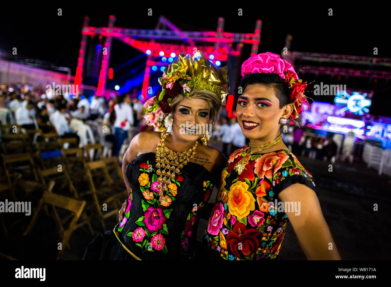 Mexican “muxes” (typically, homosexual men wearing female clothes) pose for a picture during the festival in Juchitán de Zaragoza, Mexico. Stock Photo