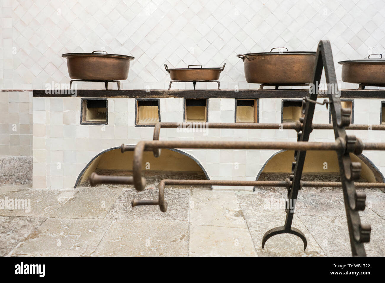 Copper utensils and piglet grate in original vintage kitchen, Sintra