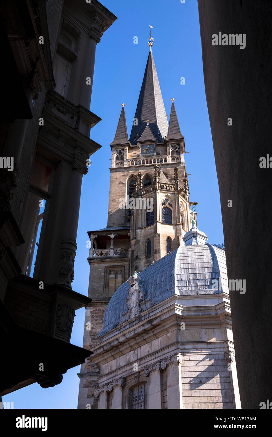 view through a lane at the Muenster square to the cathedral in Aachen, North Rhine-Westphalia, Germany.  Blick durch Gasse am Muensterplatz zum Dom, A Stock Photo