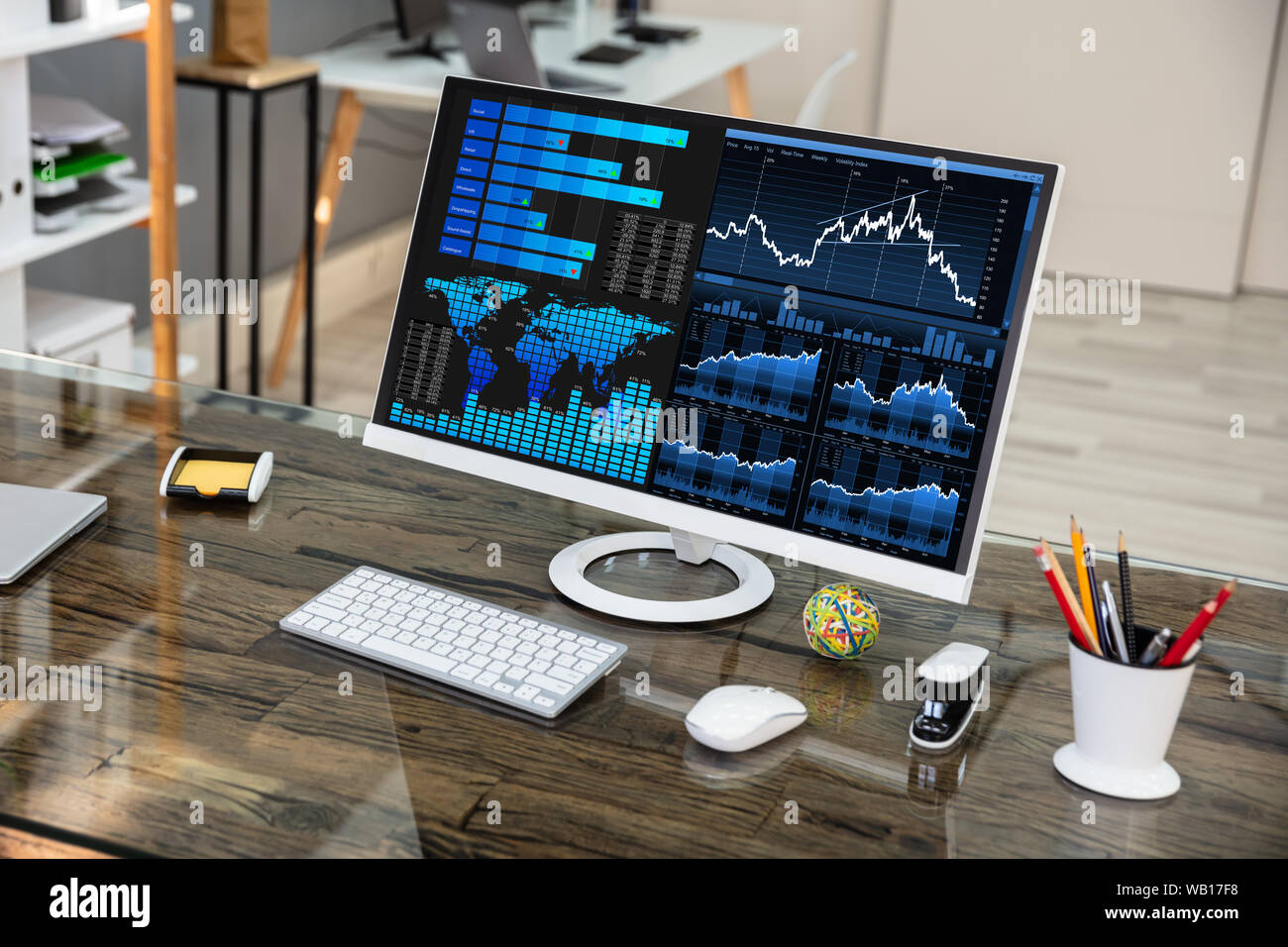 Close-up Of Desktop Computer Showing Graph On Office Desk Stock Photo ...