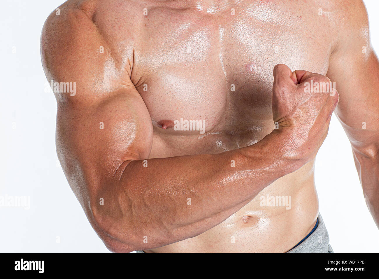 Brutal strong athletic bodybuilding men posing in studio. Bodybuilding and healty life concept Stock Photo