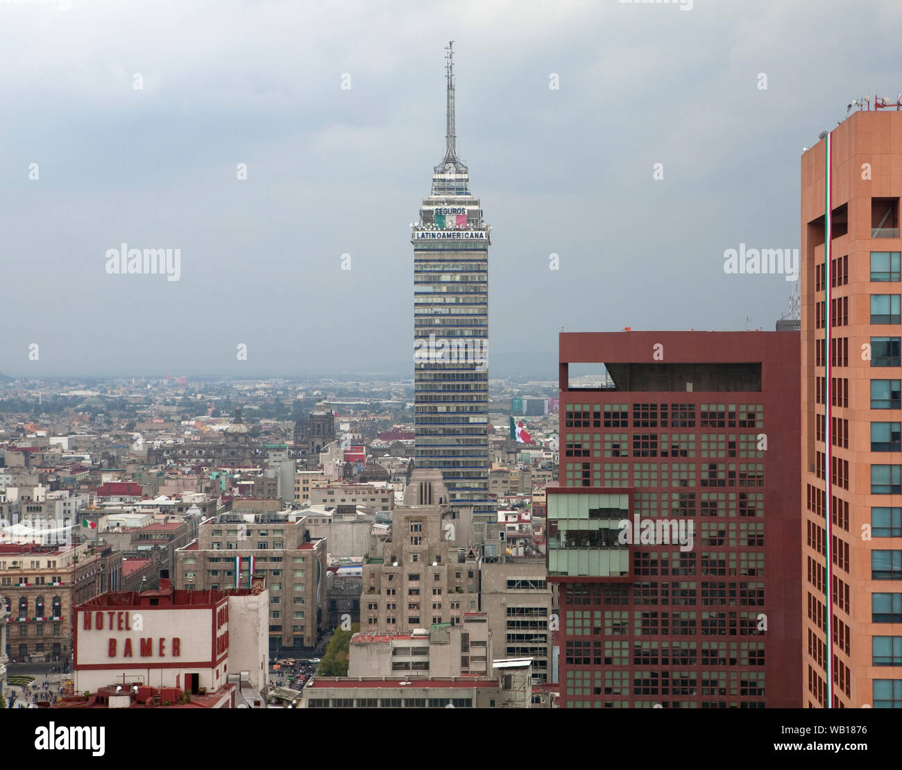 An aerial view of the Mexico City skyline with office blocks and the transmitter tower in the middle. Stock Photo