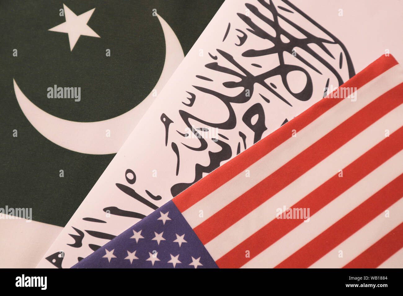 Concept showing of US, Pakistan and Taliban deal preocess showing with flags. Stock Photo