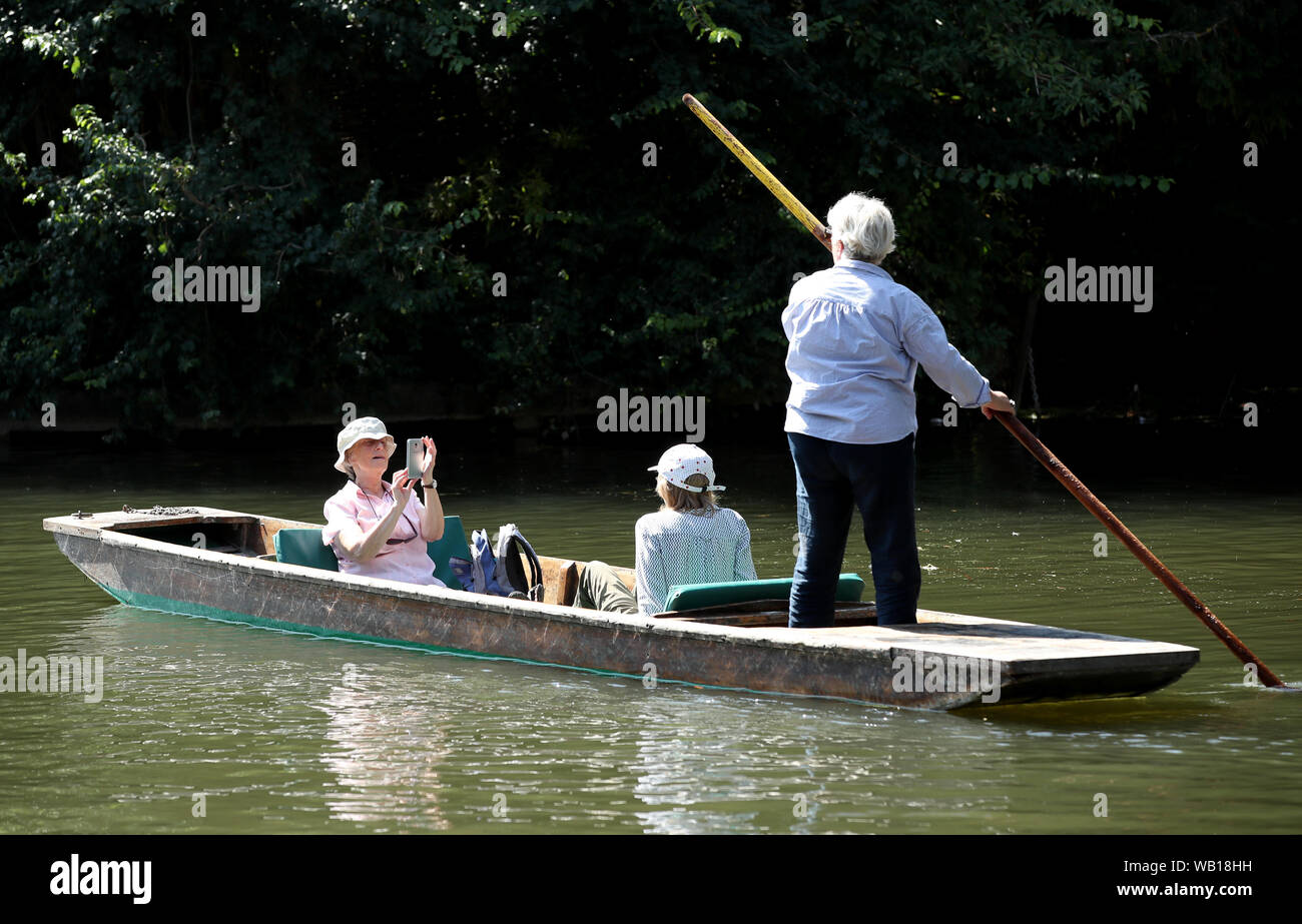 Cambridge, UK. 23 August 2019. Tourist enjoy a punt ride along the river Cam in Cambridge, as temperatures are set to hit 30 degrees over the weekend. Stock Photo