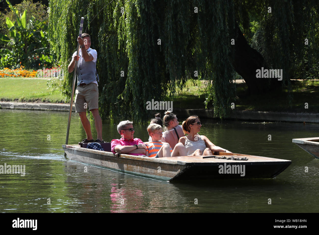 Cambridge, UK. 23 August 2019. Tourist enjoy a punt ride along the river Cam in Cambridge, as temperatures are set to hit 30 degrees over the weekend. Stock Photo