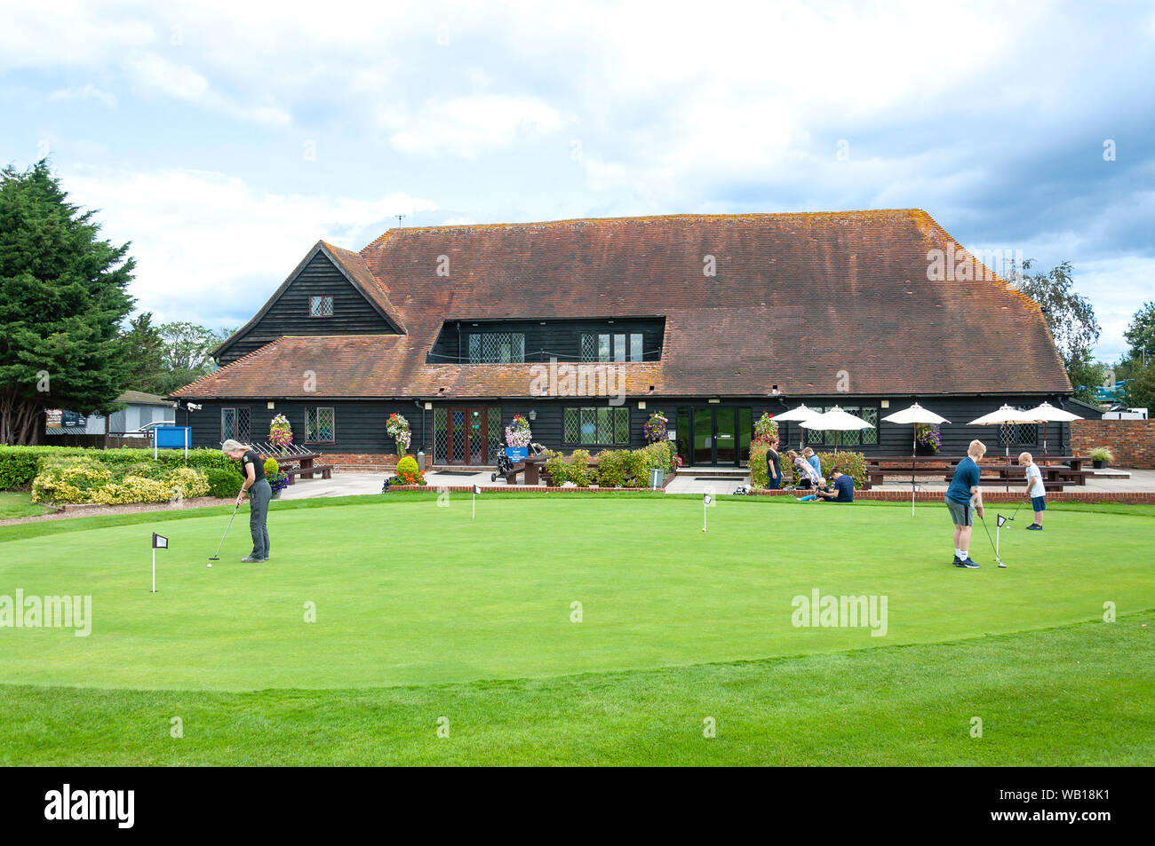 Putting green and clubhouse at Sunbury Golf Centre, Charlton Lane, Shepperton, Surrey, United Kingdom Stock Photo
