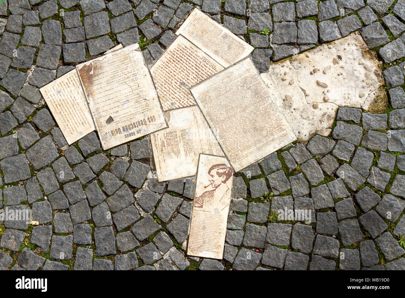 White Rose memorial of leaflets scattered on the pavement outside Ludwig Maximilian University building in Munich, Germany. Stock Photo