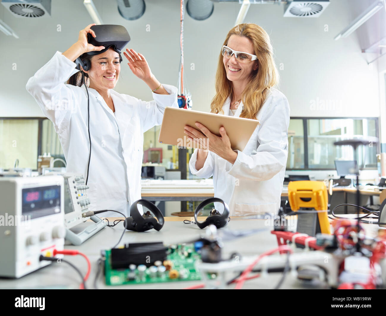 Female technicians working with tablet and vr glasses Stock Photo