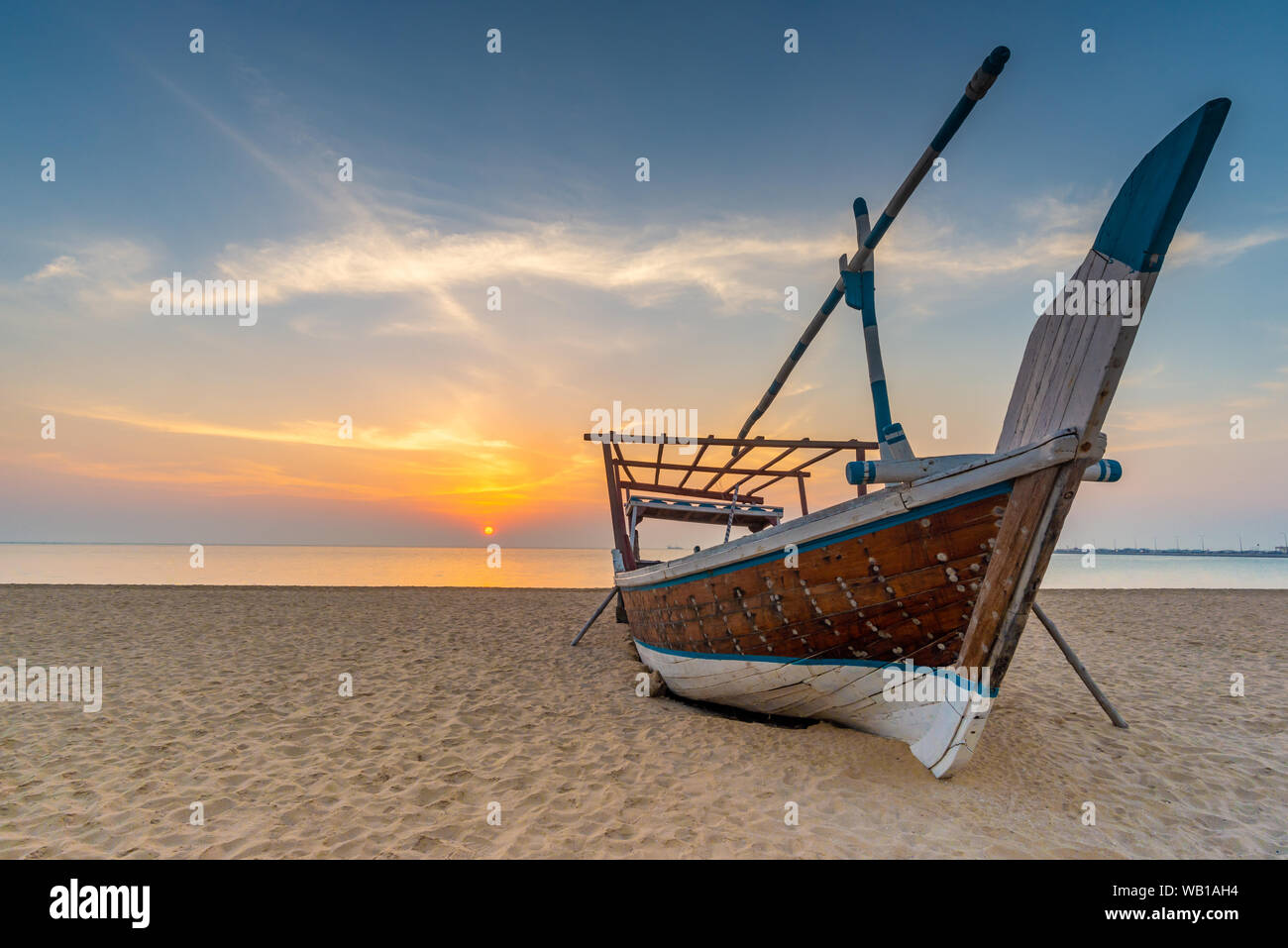 Traditional Arabian boat on a beach. Taken early morning on a beach near Al Wakrah, Qatar Stock Photo