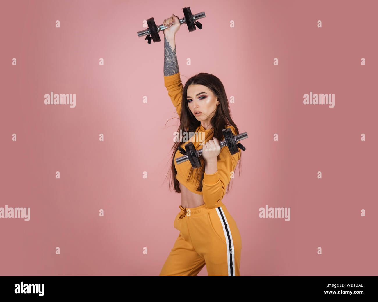 womens day. womens day concept. womens power at female day holiday. girl with barbells as symbol of womens day. be the woman Stock Photo