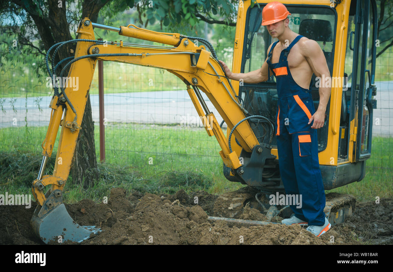 Excavation concept. Man operated excavator for ground excavation