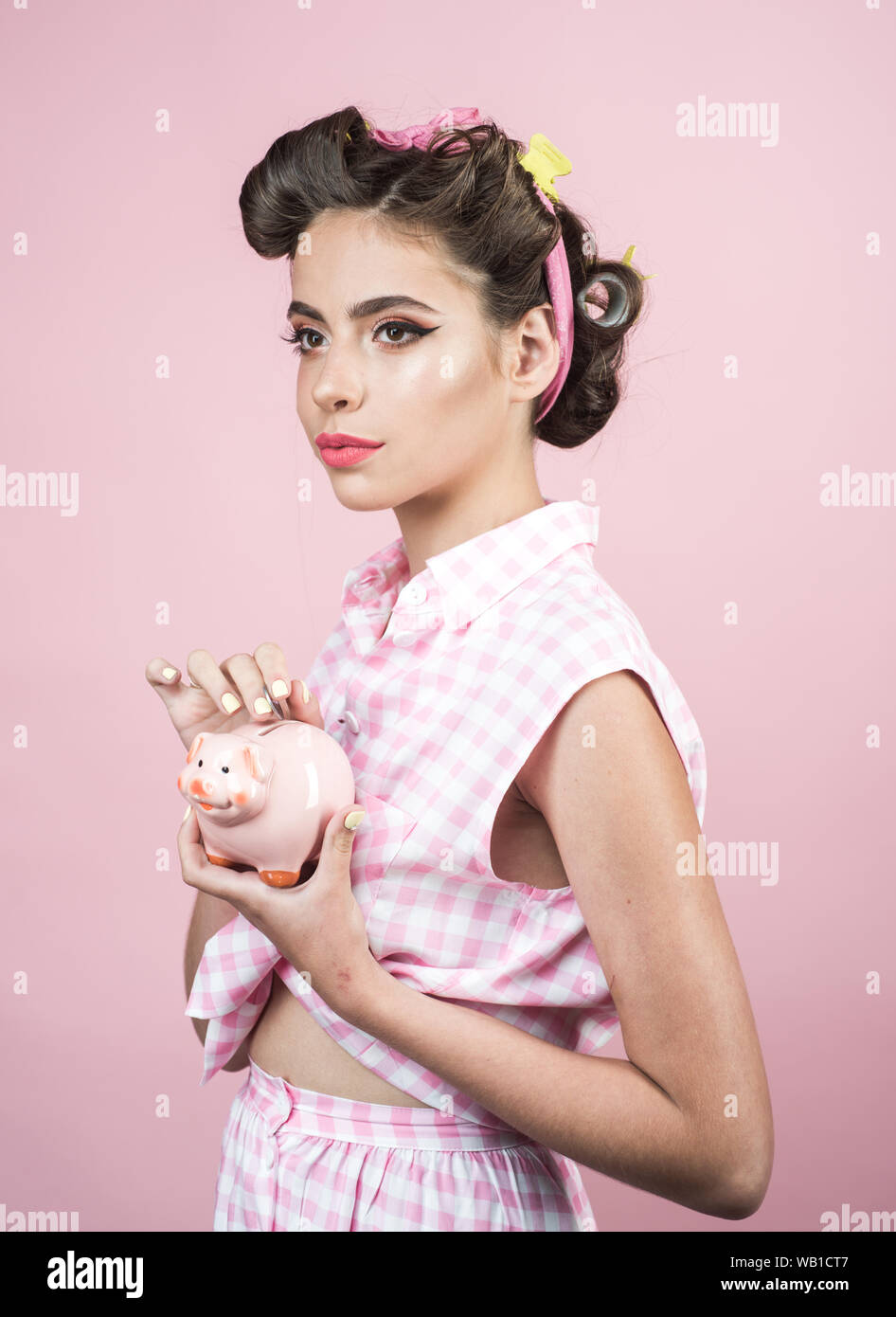 pin up woman with trendy makeup. retro woman with moneybox. pinup girl with fashion hair. girl vintage style. loan. Money. Housewife. Starti Stock Photo Alamy