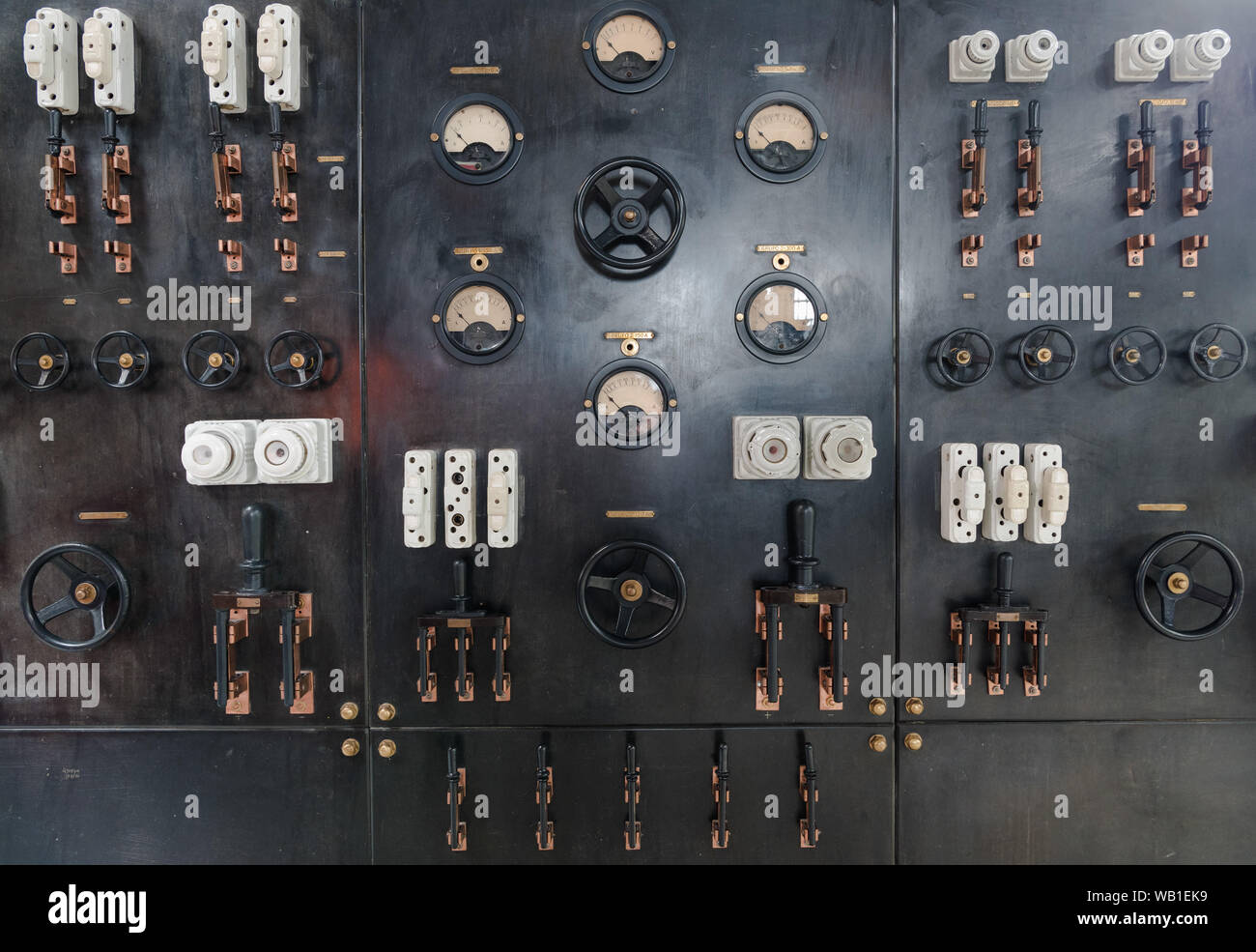 Control panel with switches gauges fuses meters flow controls in