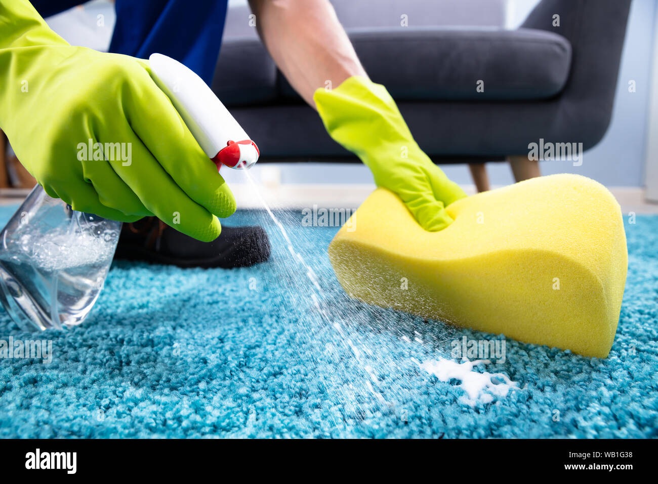 Cropped Hands Cleaning Rug With Soap Foam At Home Stock Photo