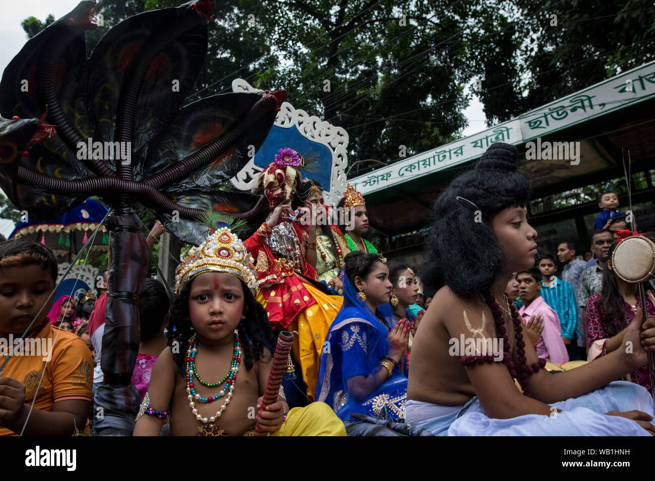 DHAKA, BANGLADESH - AUGUST 23 : Hindu devotees parade as they take part in the celebrations of Janmashtami, a festival marking the birth of Hindu deit Stock Photo