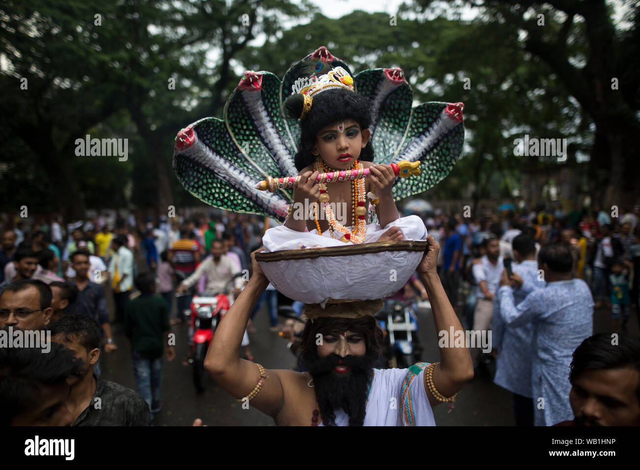 DHAKA, BANGLADESH - AUGUST 23 : Hindu devotees parade as they take part in the celebrations of Janmashtami, a festival marking the birth of Hindu deit Stock Photo