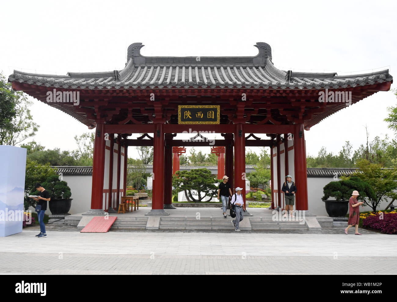 (190823) -- BEIJING, Aug. 23, 2019 (Xinhua) -- Visitors are seen at the Shaanxi Garden at the Beijing International Horticultural Exhibition in Beijing, capital of China, Aug. 22, 2019. As a land-locked province, Shaanxi stretches the drainage areas of the Yangtze River and the Yellow River, the two longest rivers in China. It boasts main parts of the Qinling Mountains, one of the biodiversity hotspots worldwide, dividing northern temperate zones from subtropical zones. Meanwhile, Shaanxi is habitat of rare protected animals.   Over the past years, Shaanxi Province has been promoting ecologica Stock Photo