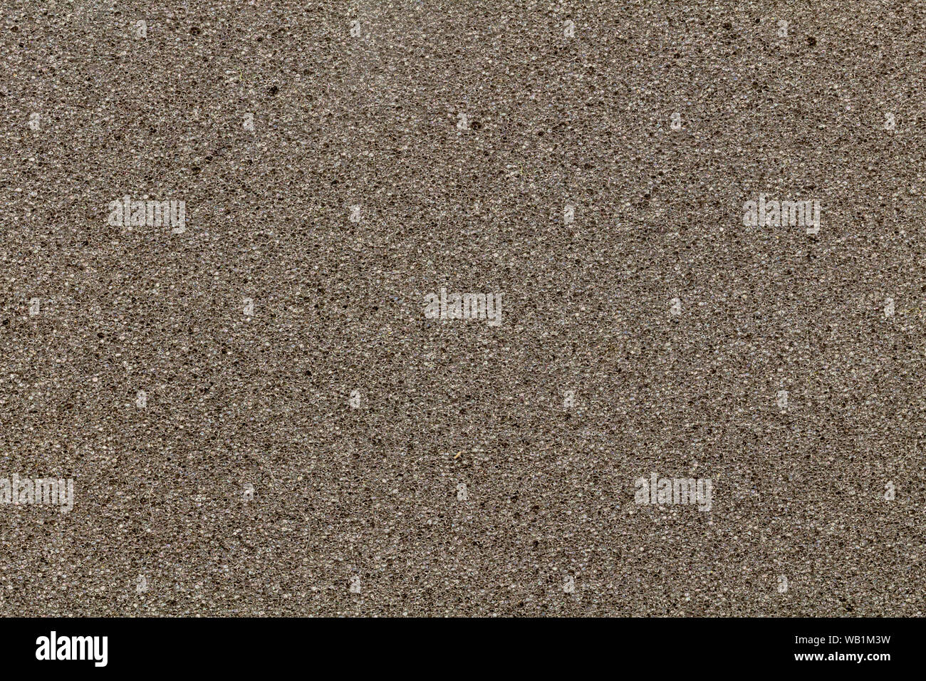 Grey synthetic sponge texture background - grey foam surface Stock Photo