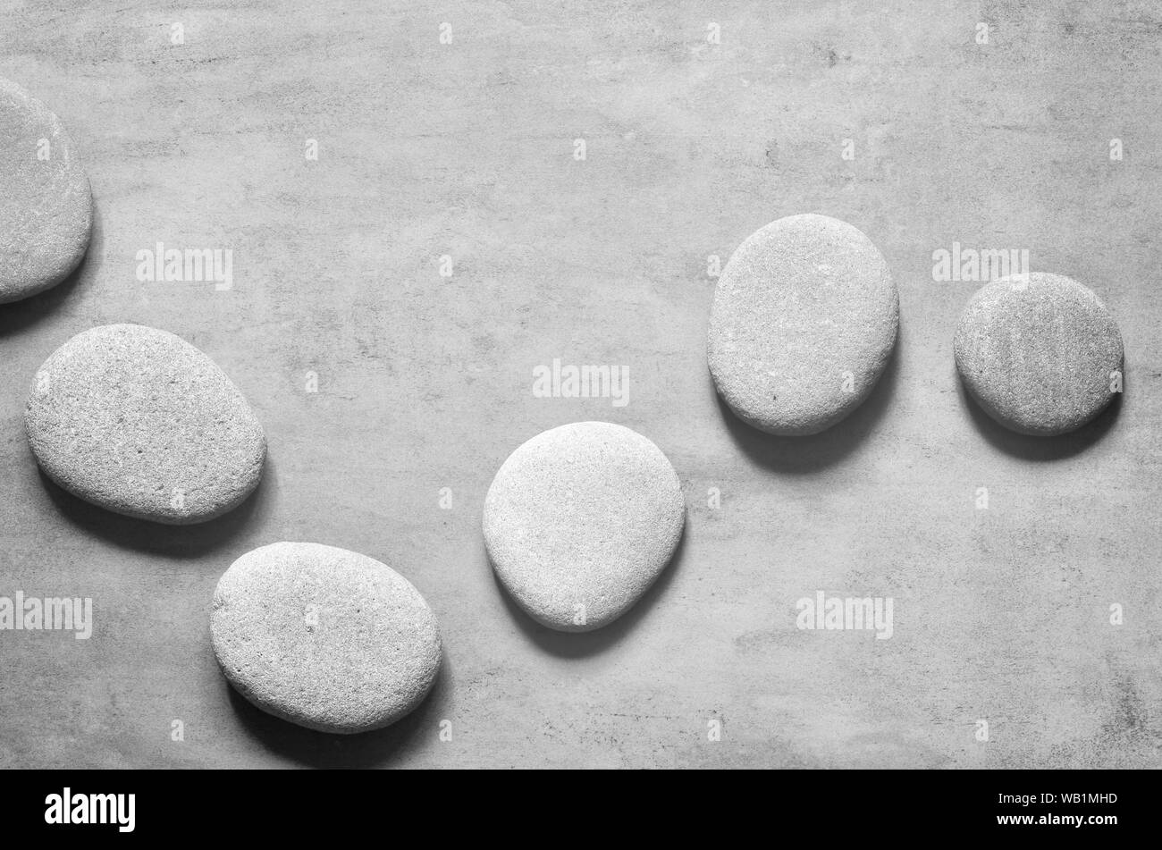 Flat lay composition with grey spa stones on grey background Stock ...