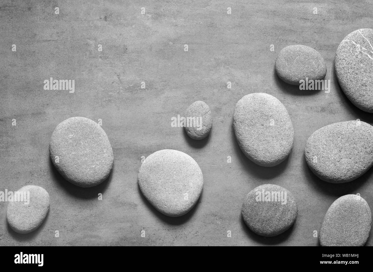 Flat lay composition with grey spa stones on grey background Stock ...