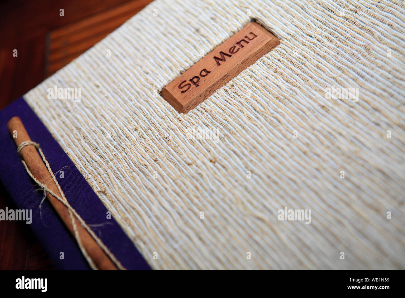 Close up with selective focus on a spa treatment menu booklet cover. Stock Photo