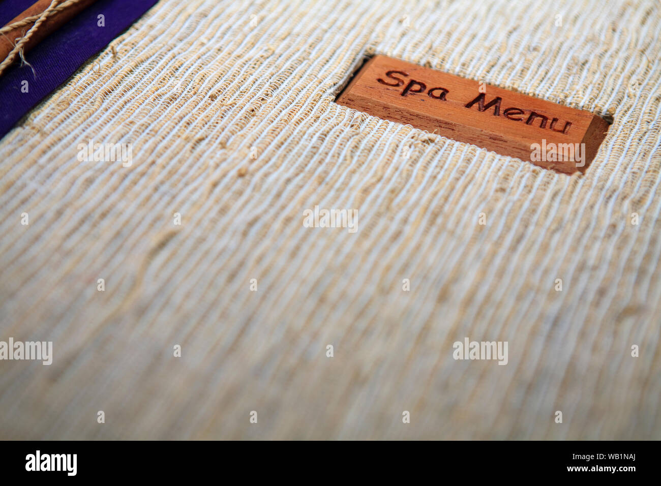 Close up with selective focus on a spa treatment menu booklet cover. Stock Photo