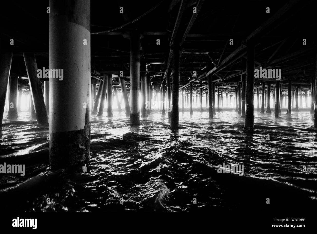 Black and white iew of the pylons of Santa Monica pier in Los Angeles USA Stock Photo