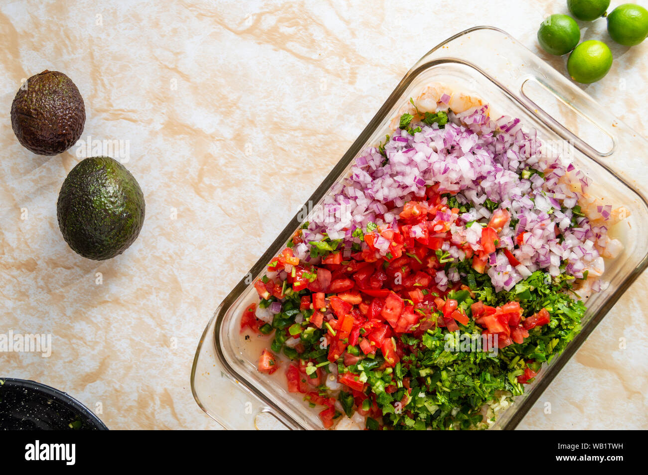 Ceviche, also known as cebiche, seviche and sebiche. Making shrimp ceviche and the ingredients