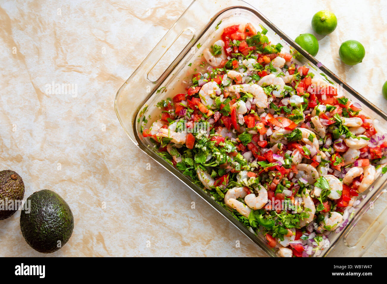 Ceviche, also known as cebiche, seviche and sebiche. Making shrimp ceviche and the ingredients