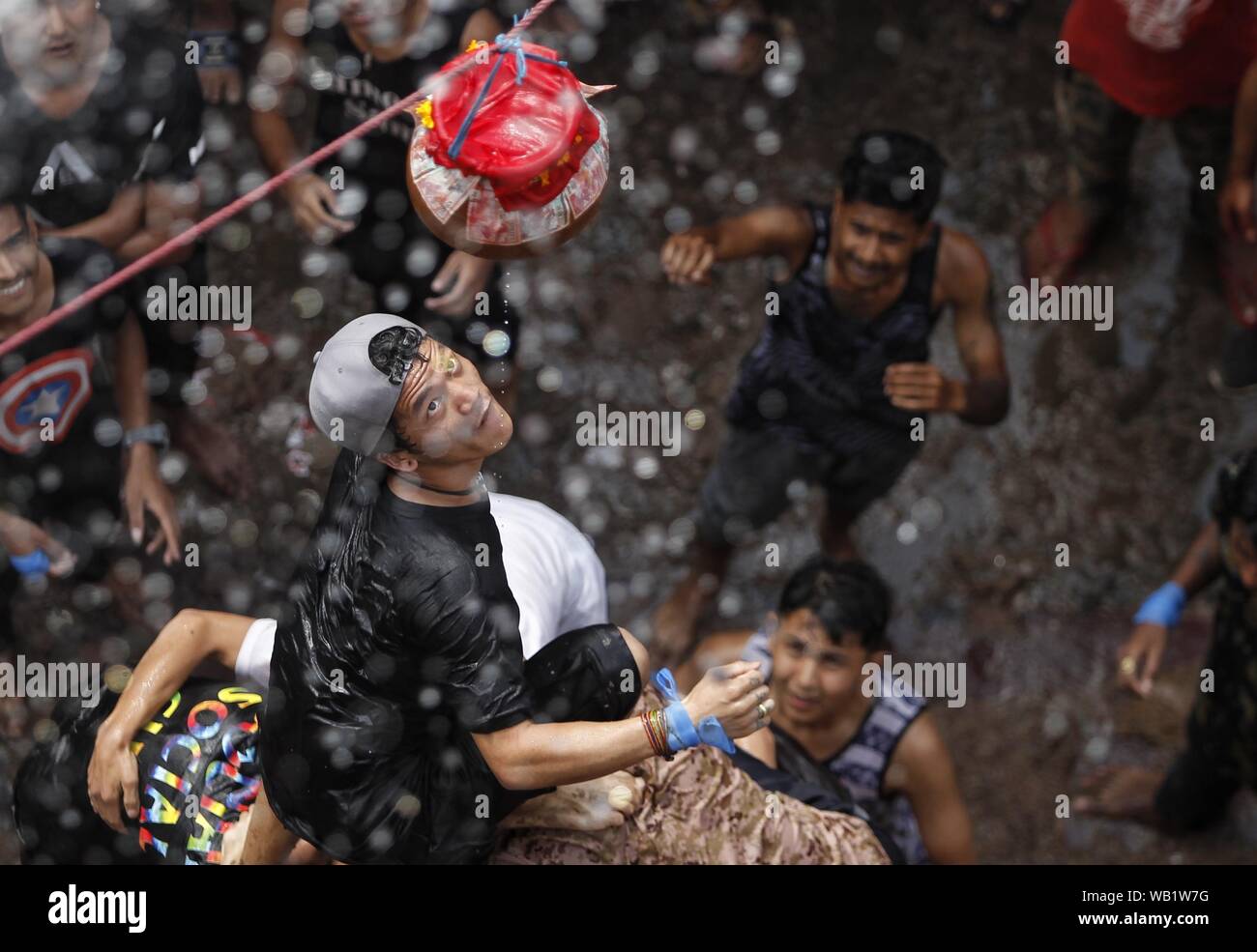 Kathmandu, Nepal. 23rd Aug, 2019. Devotees take part in Matka Breaking ...