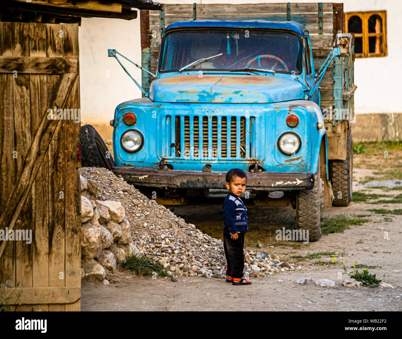 Village Life in Sarytag, Tajikistan. Little man in Tajikistan Stock Photo