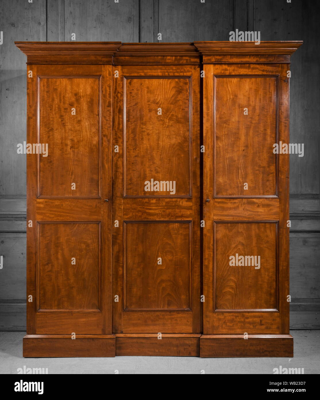 Antique Mahogany Wardrobe Closed Isolated On A Black White Wall