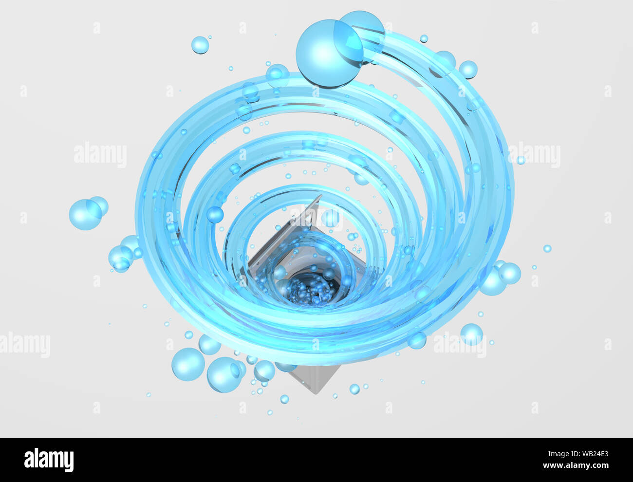 Top view of clothes washing machine with the door open, inside it comes a blue water jet in the form of a spiral with bubbles floating in white backgr Stock Photo