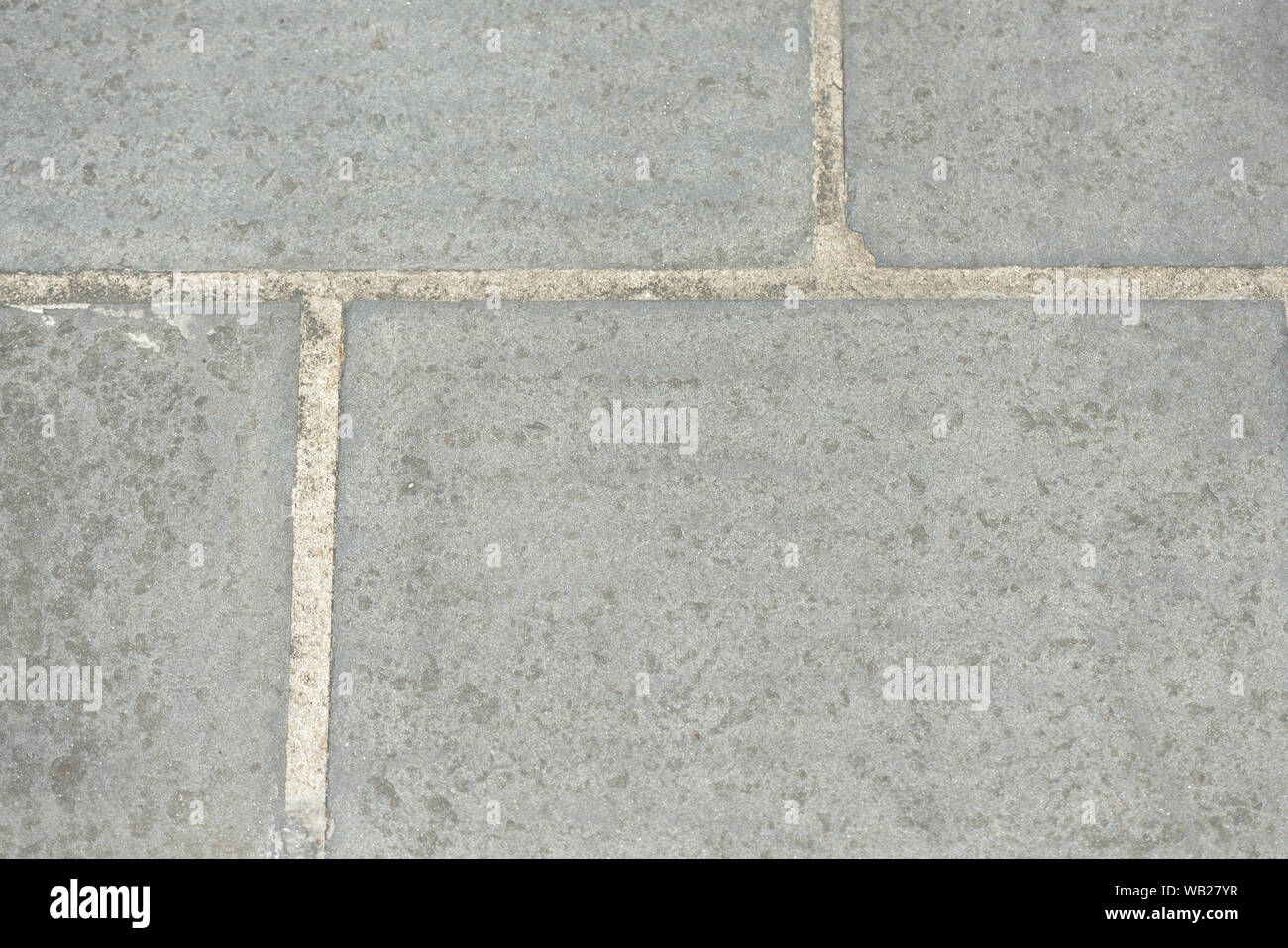 Gray paving slabs closeup, top view. Abstract background Stock Photo