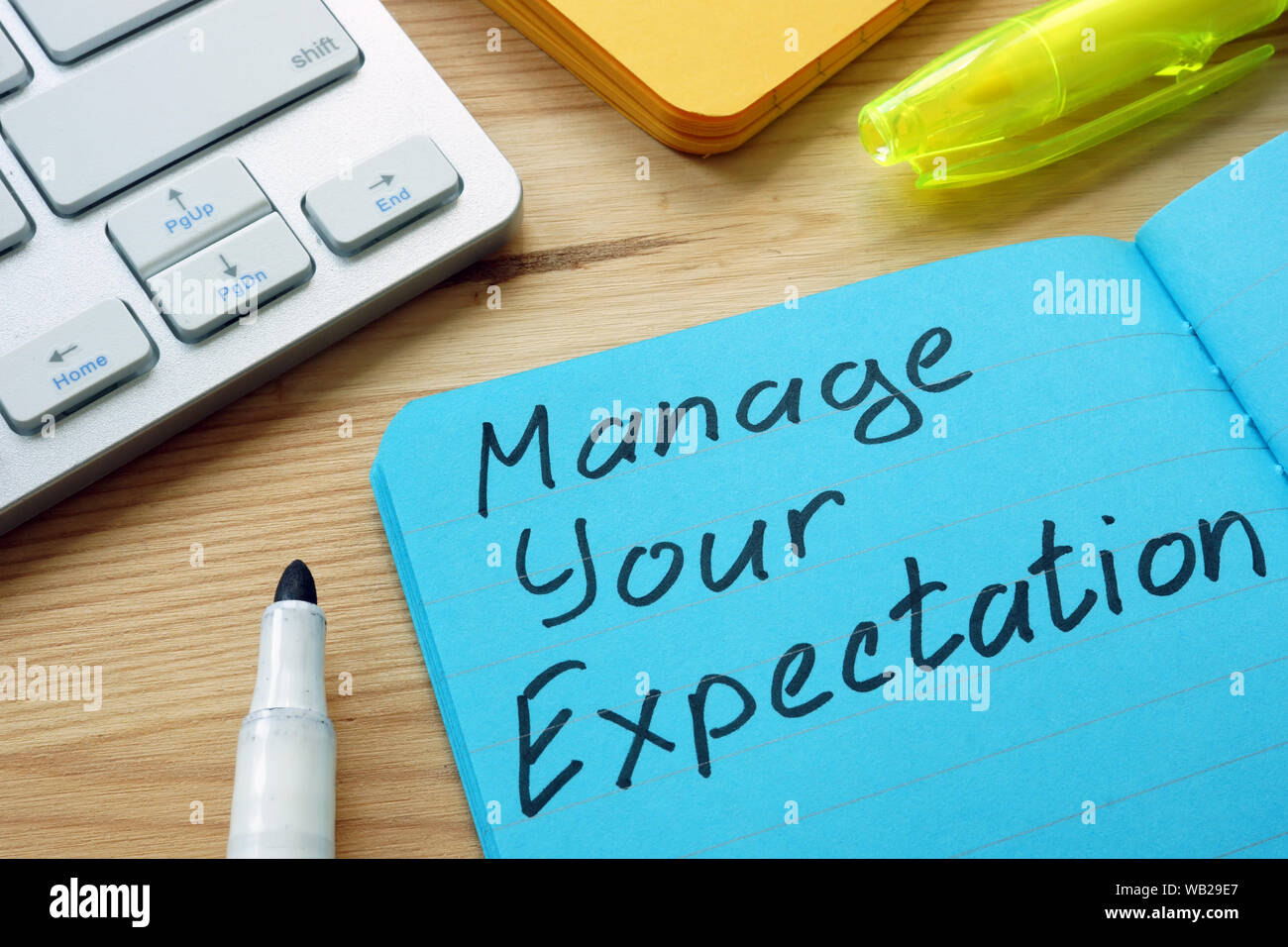 Manage your expectations sign on the page. Stock Photo