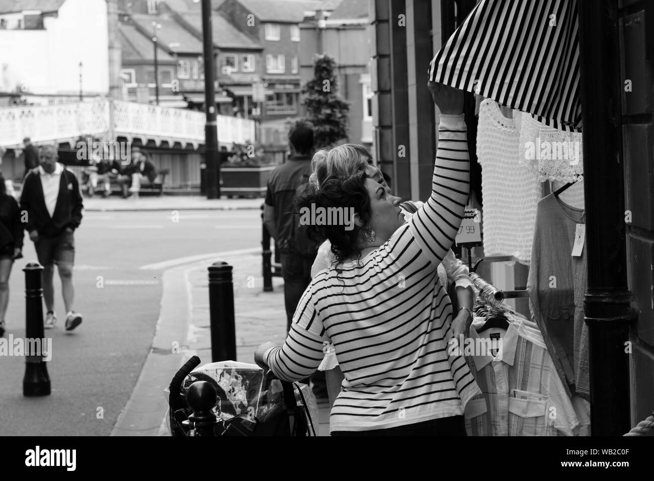 Customer standing looking display Black and White Stock Photos & Images ...