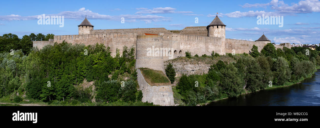 The medieval German castle in Estonia and the Russian fortress Ivangorod are separated by the Narva River. The bridge between them forms the border of Stock Photo